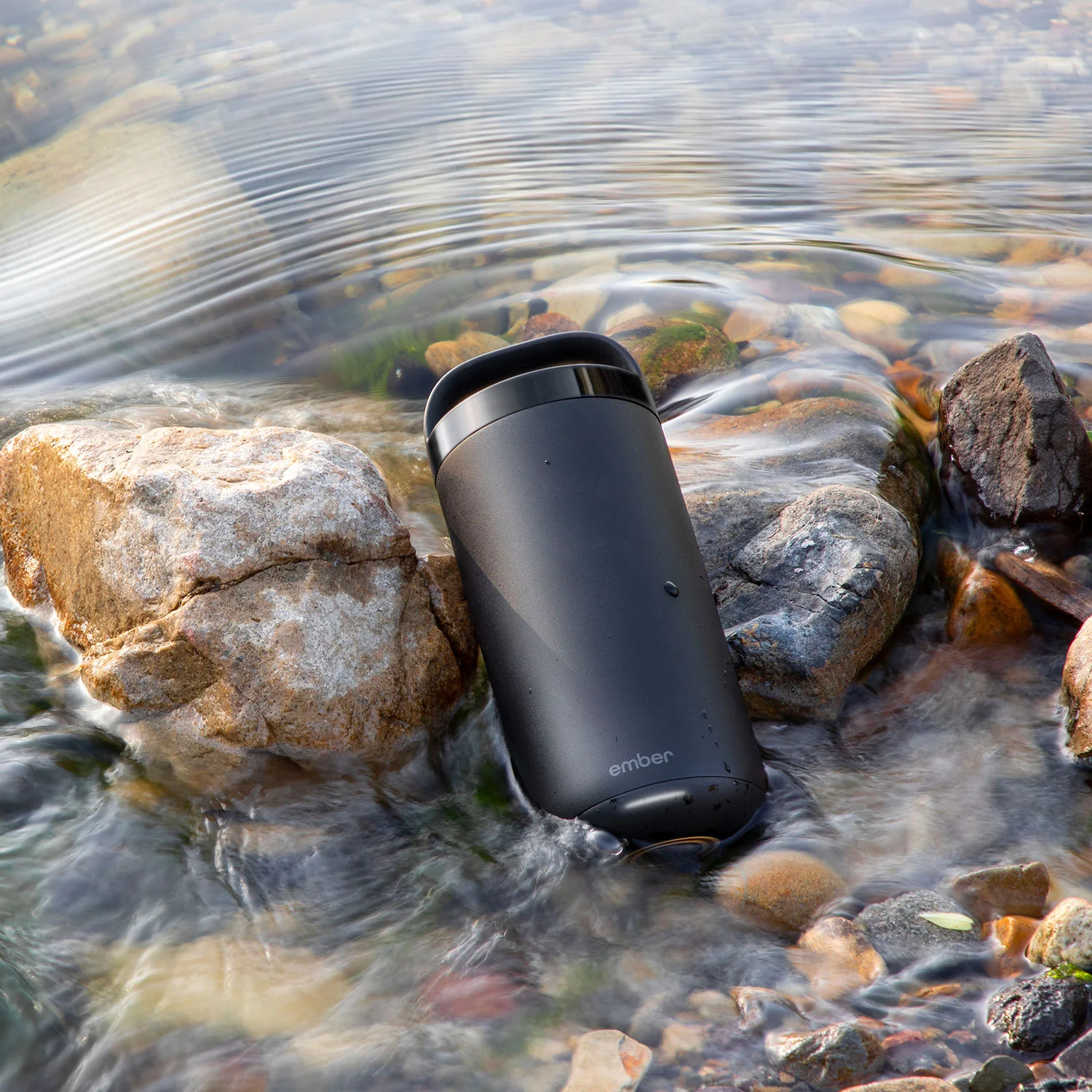 Close-up of the two interchangeable lids: leak-proof handle lid and spill-proof sliding lid
